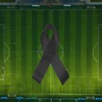 Simbolo lutto sopra a campo di calcio